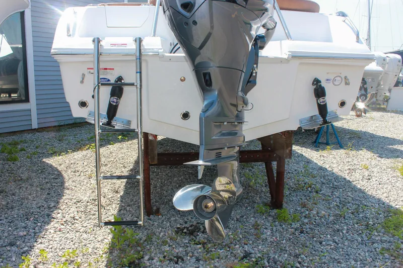 Slide: The Image of Rear view of 2026 Sea Hunt Ultra 219 boat with outboard motor and ladder. - 27