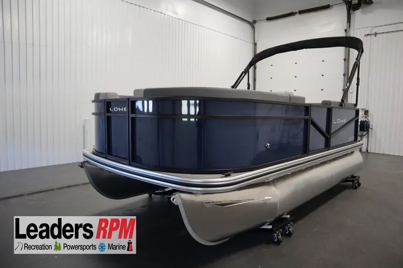 The Image of 2026 Lowe LS 170 pontoon boat in showroom, Leaders RPM logo visible. - 0