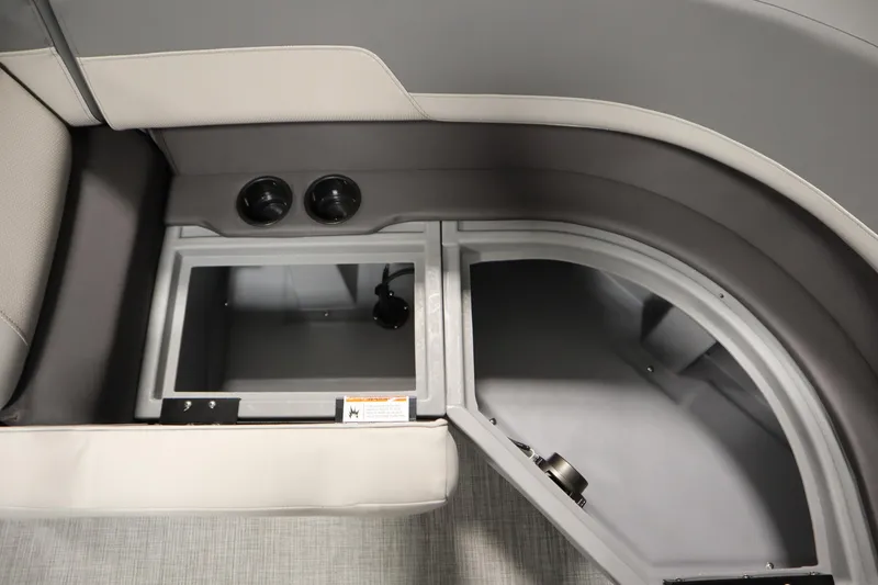 Slide: The Image of Interior storage compartment of 2026 Lowe LS 170 boat with cup holders. - 13