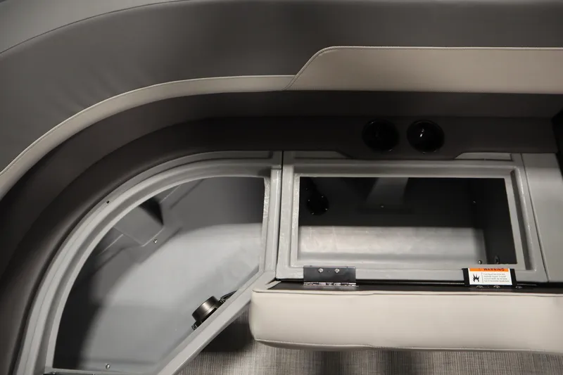 Slide: The Image of Interior view of 2026 Lowe LS 170 boat storage compartment with gray upholstery. - 15