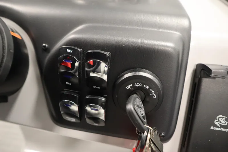 Slide: The Image of Control panel of 2026 Lowe LS 170 boat with ignition and switches. - 21