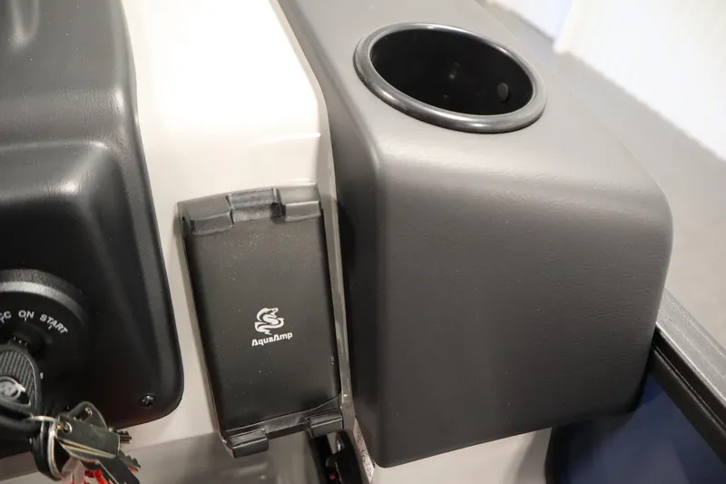 Slide: The Image of Control panel of 2026 Lowe LS 170 boat with AquaAmp and cup holder. - 22