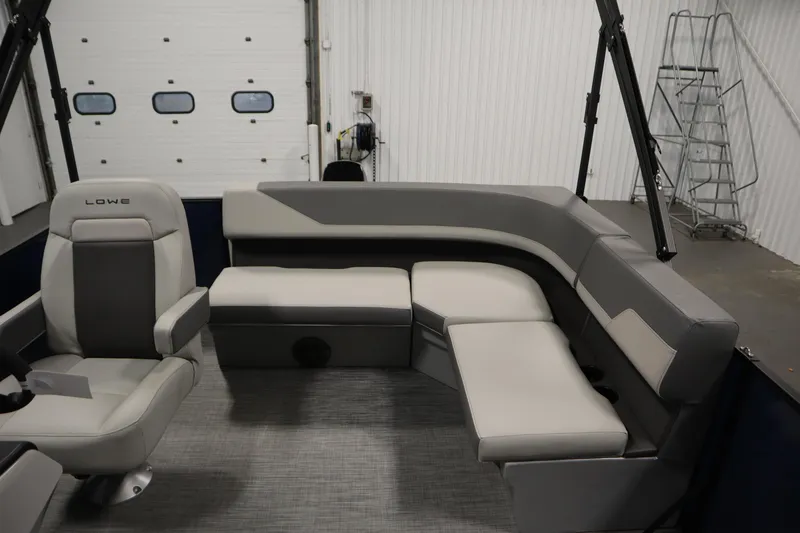 Slide: The Image of 2026 Lowe LS 170 boat interior with gray seating and modern design. - 25