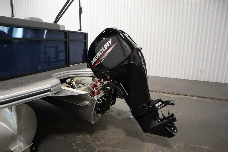 Slide: The Image of 2026 Lowe LS 170 boat with Mercury outboard motor in a showroom. - 28