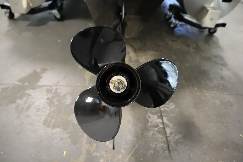 Slide: The Image of Close-up of a Lowe LS 170 boat propeller, 2026 model, on a concrete floor. - 30