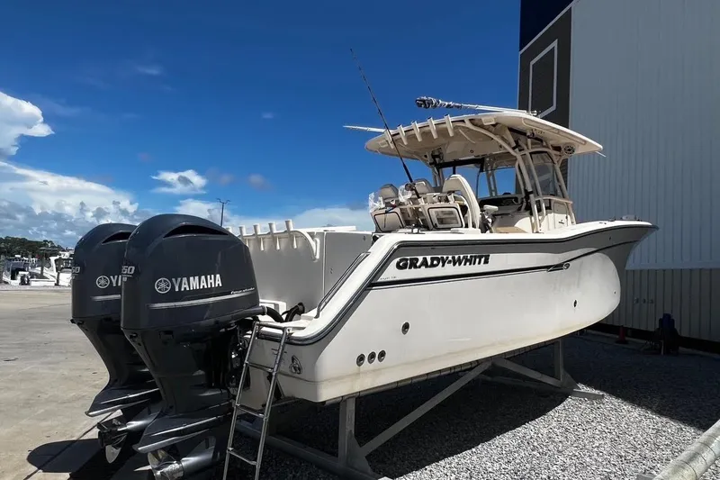 Slide: The Image of 2015 Grady-White Canyon 336 boat with twin Yamaha engines on a sunny day. - 17