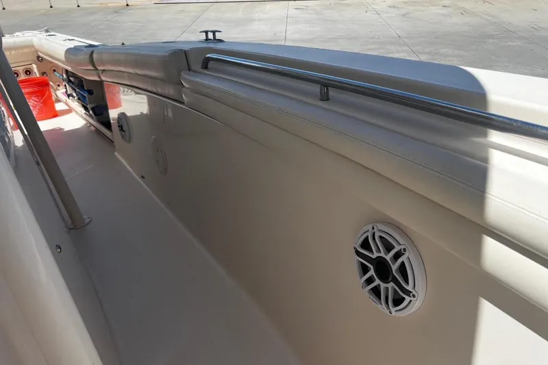 Slide: The Image of 2015 Grady-White Canyon 336 boat interior with speaker and railing detail. - 25