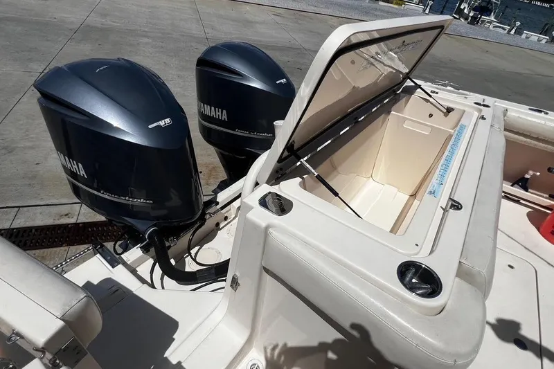 Slide: The Image of 2015 Grady-White Canyon 336 boat with Yamaha outboard engines and open storage compartment. - 29
