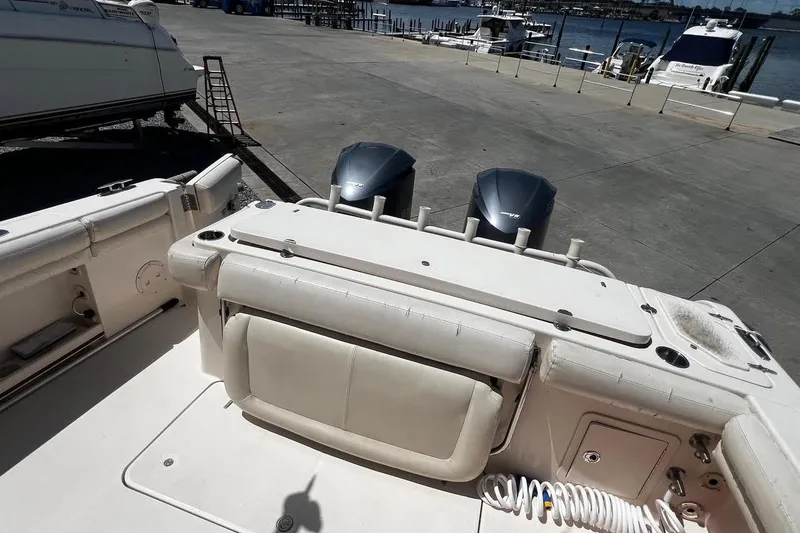 Slide: The Image of 2015 Grady-White Canyon 336 boat with dual engines at a marina dock. - 32