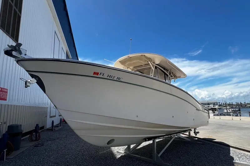 Slide: The Image of 2015 Grady-White Canyon 336 boat on dry dock under clear blue sky. - 40