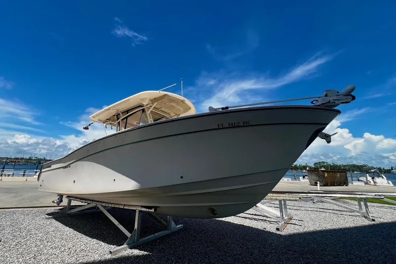 Slide: The Image of 2015 Grady-White Canyon 336 boat on display under clear blue sky. - 42