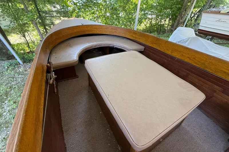 Slide: The Image of 1904 Fay & Bowen Torpedo Launch interior with wooden and cushioned seating. - 10