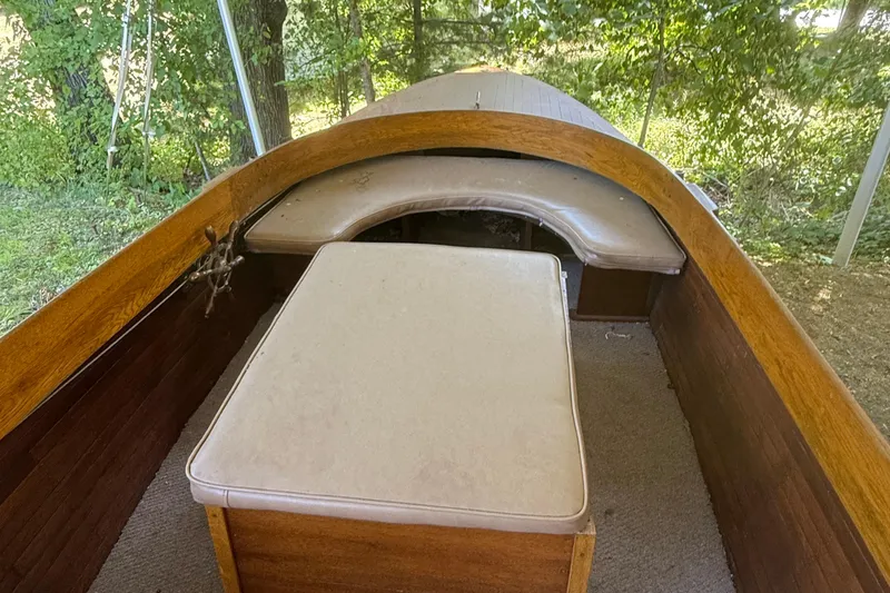 Slide: The Image of 1904 Fay & Bowen Torpedo Launch interior with wooden finish and cushioned seating. - 11