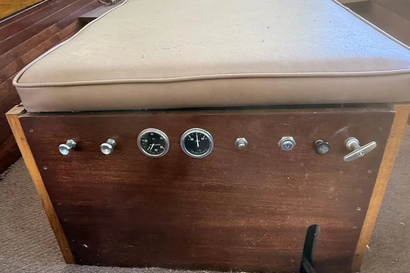 Slide: The Image of 1904 Fay & Bowen Torpedo Launch dashboard with gauges and controls, featuring a cushioned seat. - 12