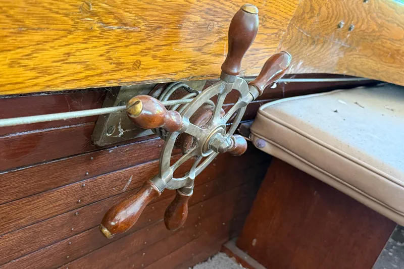 Slide: The Image of Steering wheel of a 1904 Fay & Bowen Torpedo Launch with wooden accents. - 13