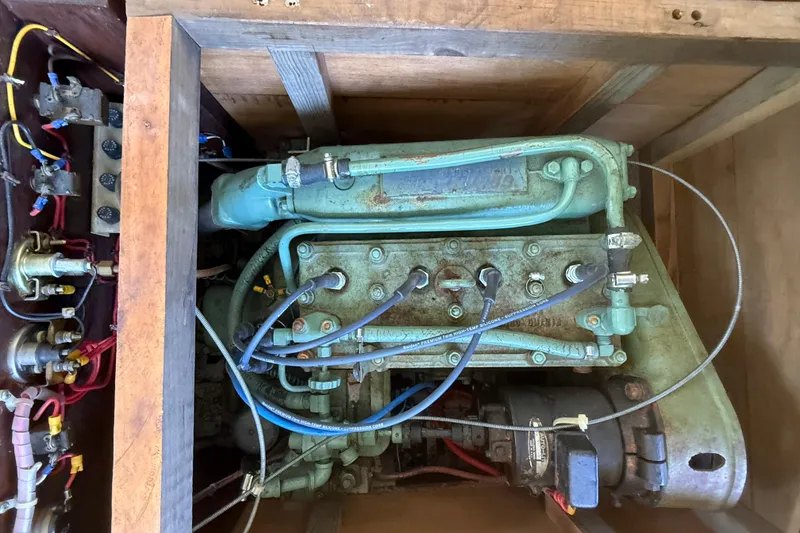 Slide: The Image of Engine of a 1904 Fay & Bowen Torpedo Launch with visible wiring and components. - 19