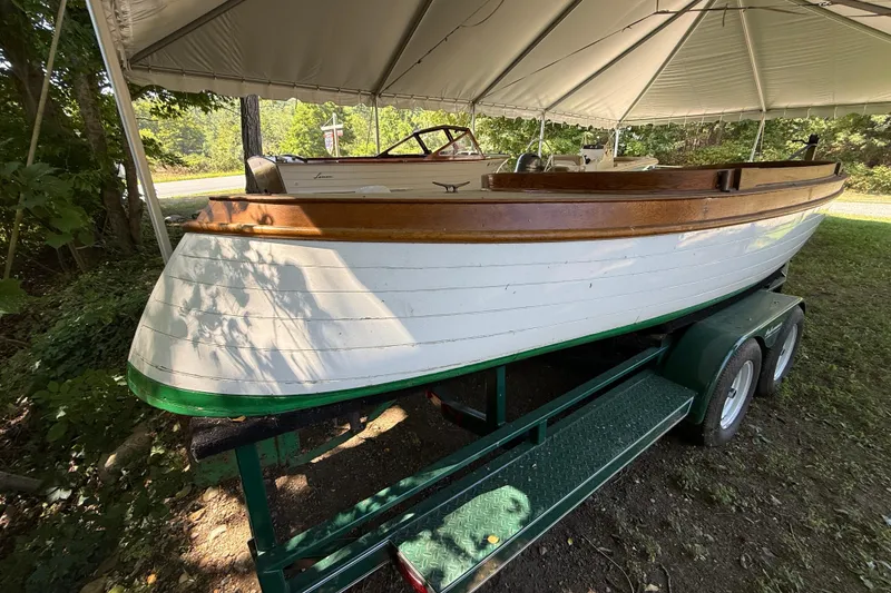 Slide: The Image of 1904 Fay & Bowen Torpedo Launch boat on trailer under canopy. - 2