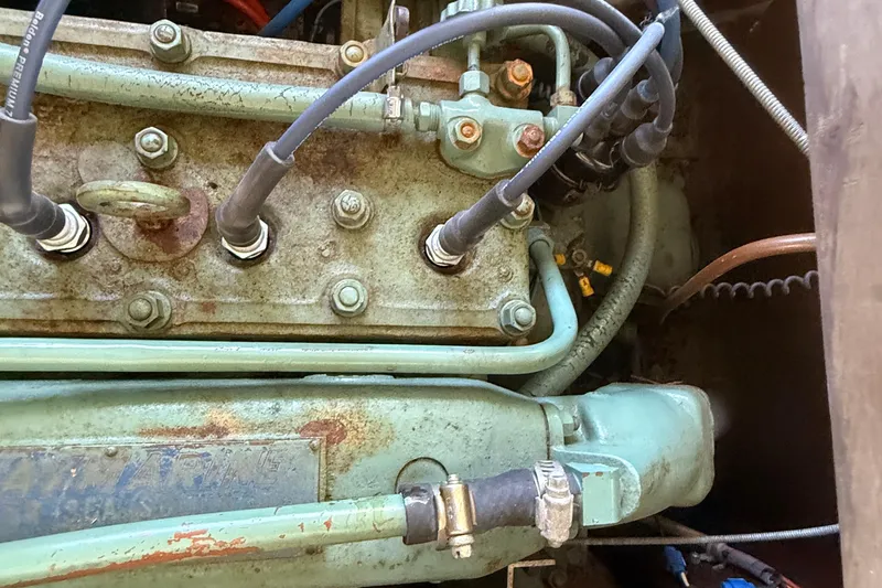 Slide: The Image of Engine of 1904 Fay & Bowen Torpedo Launch with visible wiring and components. - 21