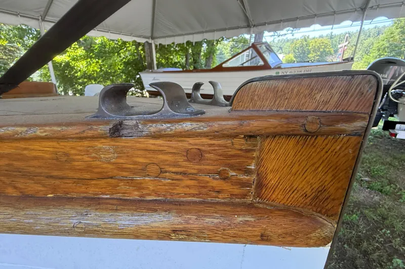 Slide: The Image of Close-up of 1904 Fay & Bowen Torpedo Launch wooden deck detail under a canopy. - 25