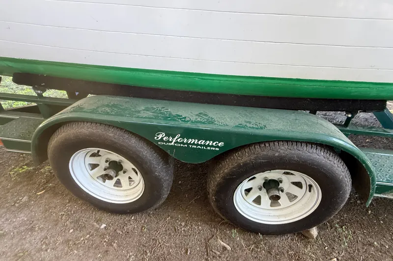Slide: The Image of Trailer for 1904 Fay & Bowen Torpedo Launch with green accents and dual wheels. - 27