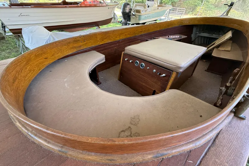 Slide: The Image of 1904 Fay & Bowen Torpedo Launch interior with wooden seating and vintage controls. - 9