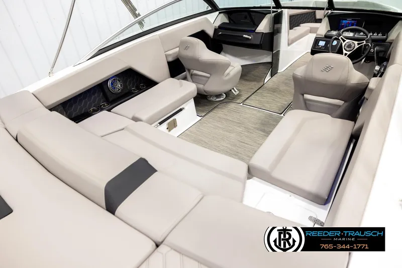 Slide: The Image of Luxurious interior of 2024 Four Winns H4 boat with plush seating and modern dashboard. - 12