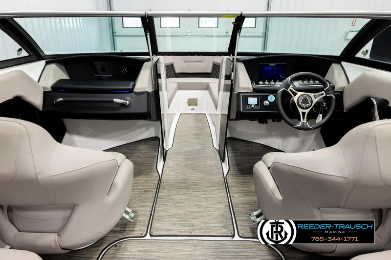 Slide: The Image of Interior of 2024 Four Winns H4 boat with modern steering and seating. - 14