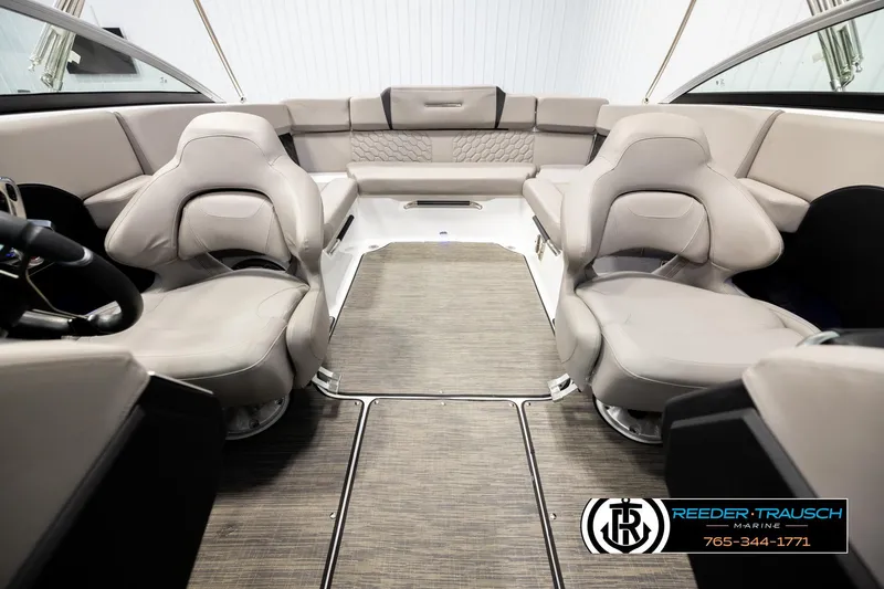 Slide: The Image of 2024 Four Winns H4 boat interior with luxurious seating and modern design. - 19