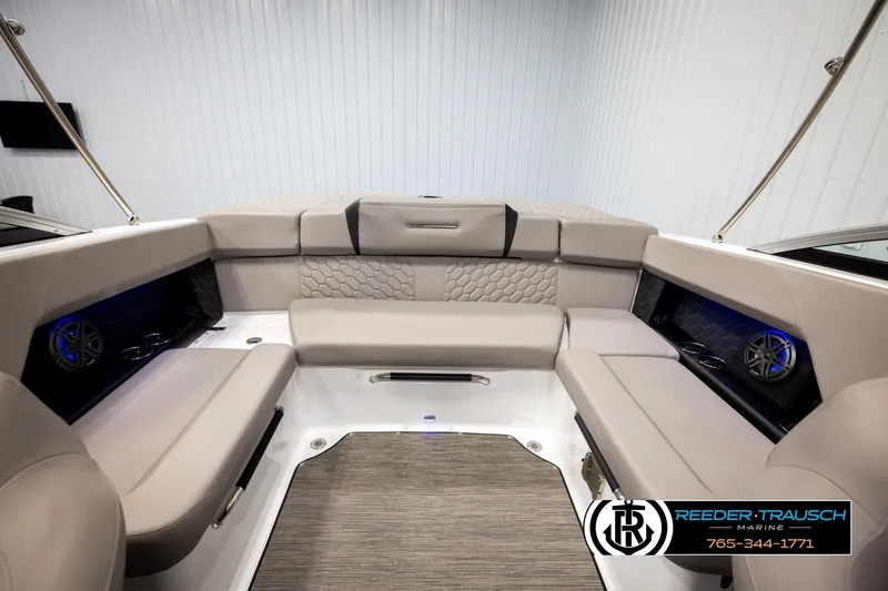 Slide: The Image of 2024 Four Winns H4 boat interior with beige seating and modern design. - 20