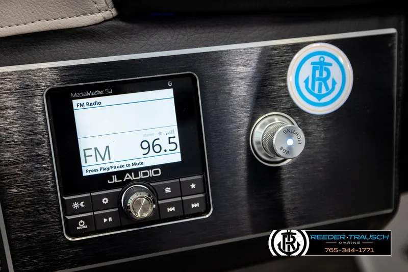 Slide: The Image of 2024 Four Winns H4 boat dashboard with JL Audio system and lighting controls. - 36