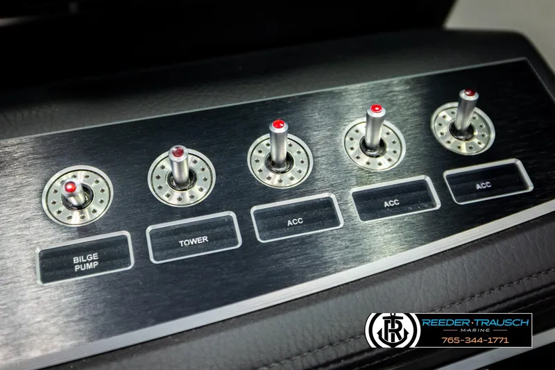 Slide: The Image of Control panel of 2024 Four Winns H4 boat with labeled switches. - 39