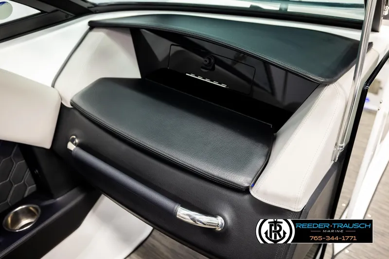 Slide: The Image of 2024 Four Winns H4 boat interior with sleek black and white design, featuring a storage compartment. - 43