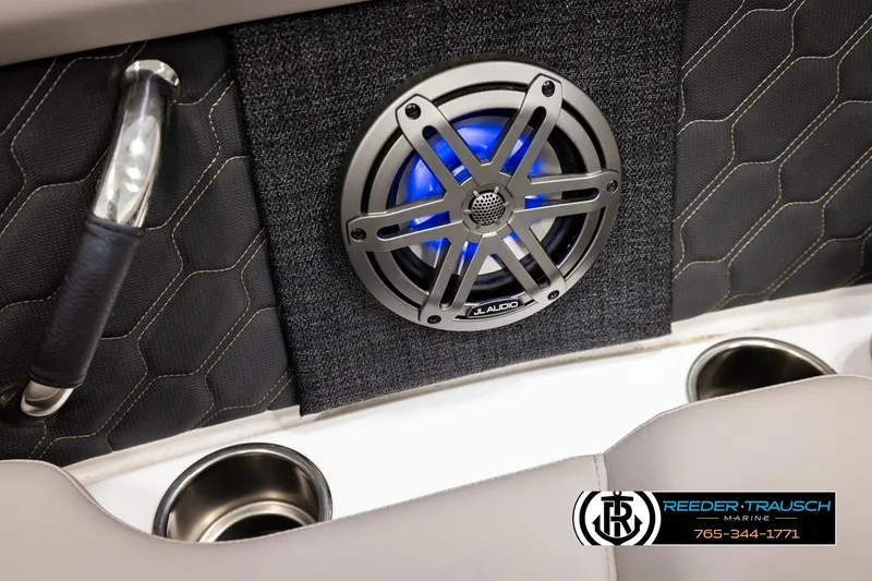 Slide: The Image of 2024 Four Winns H4 boat interior with JL Audio speaker and cup holders. - 44