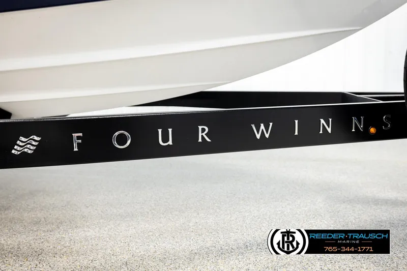 Slide: The Image of 2024 Four Winns H4 boat trailer with logo, displayed at Reeder-Trausch Marine. - 61