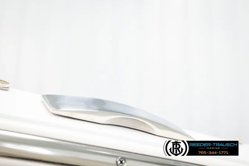 Slide: The Image of 2024 Four Winns H4 boat detail with sleek metallic design, Reeder-Trausch Marine logo visible. - 65