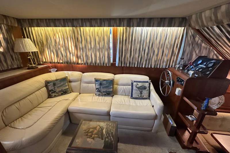 Slide: The Image of Interior of 1985 Chris-Craft 426 Catalina with leather seating and nautical decor. - 22