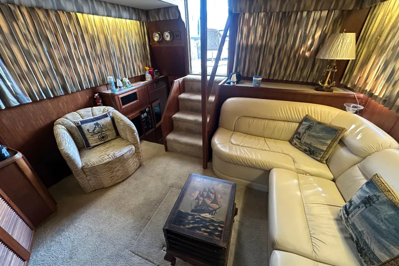 Slide: The Image of Interior of 1985 Chris-Craft 426 Catalina yacht with cozy seating and nautical decor. - 24