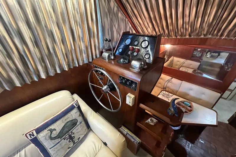 Slide: The Image of Interior helm of 1985 Chris-Craft 426 Catalina with vintage controls and nautical decor. - 26