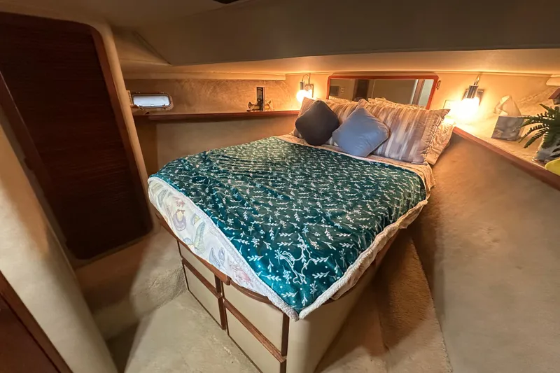 Slide: The Image of Cozy cabin interior of 1985 Chris-Craft 426 Catalina with a neatly made bed. - 35