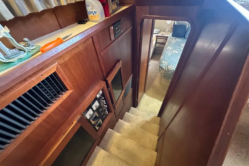 Slide: The Image of Interior view of 1985 Chris-Craft 426 Catalina yacht, showing stairs and cabin entrance. - 40