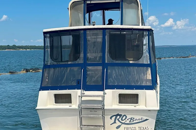 Slide: The Image of 1985 Chris-Craft 426 Catalina boat on water, Frisco, Texas, clear sky background. - 8