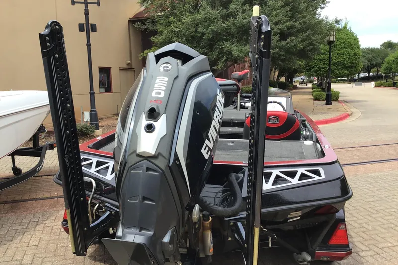 Slide: The Image of 2018 Ranger Z520L boat with Evinrude engine, parked outdoors. - 3