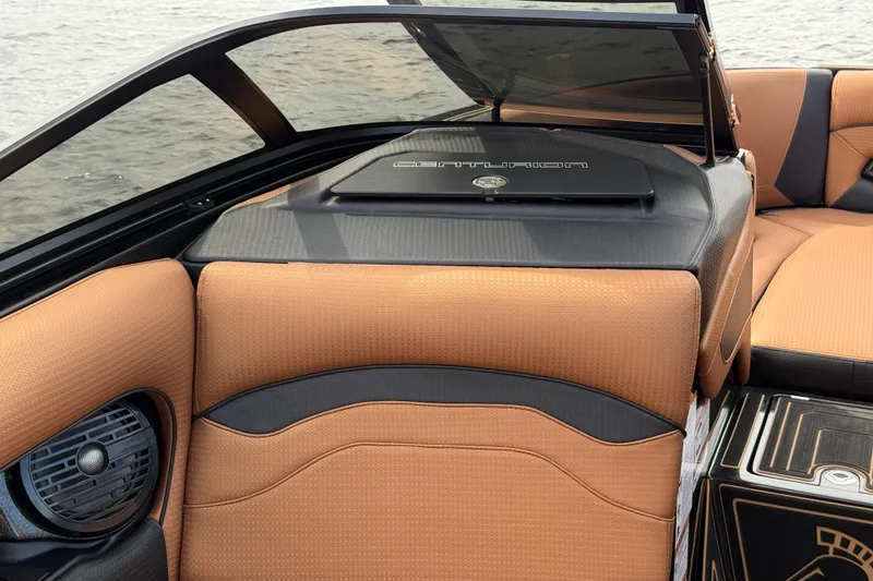 Slide: The Image of 2020 Centurion Ri257 boat interior with tan upholstery and sleek design. - 16