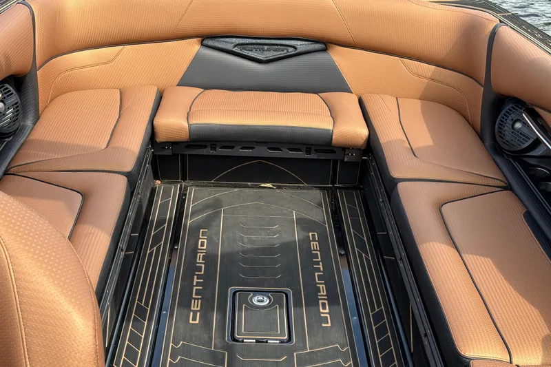 Slide: The Image of 2020 Centurion Ri257 boat interior with tan and black seating. - 18