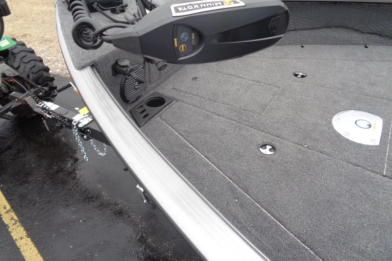 Slide: The Image of 2025 Lund 1875 Impact XS Sport boat deck with trolling motor and trailer hitch. - 12