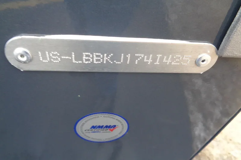 Slide: The Image of 2025 Lund 1875 Impact XS Sport boat identification plate with NMMA certification sticker. - 14
