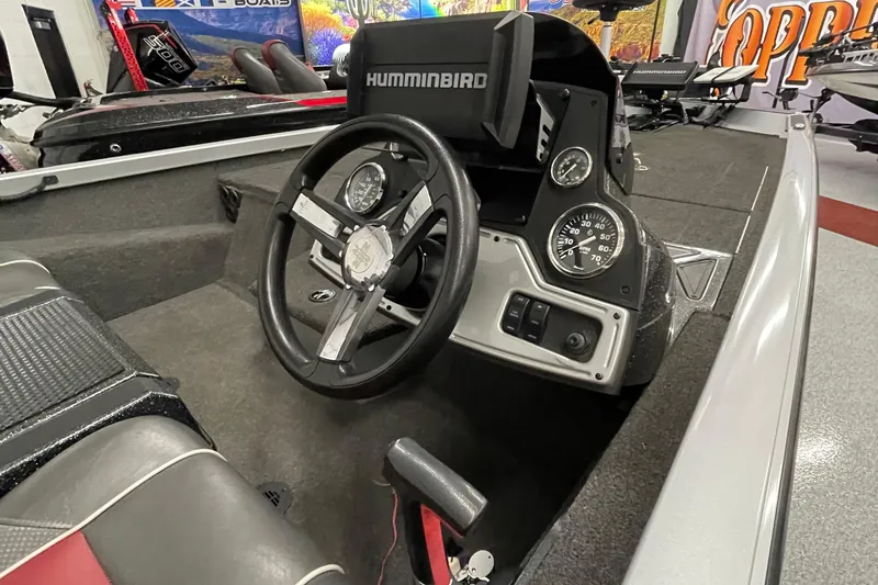 Slide: The Image of 2018 Ranger RT198P boat dashboard with steering wheel and Humminbird electronics. - 4