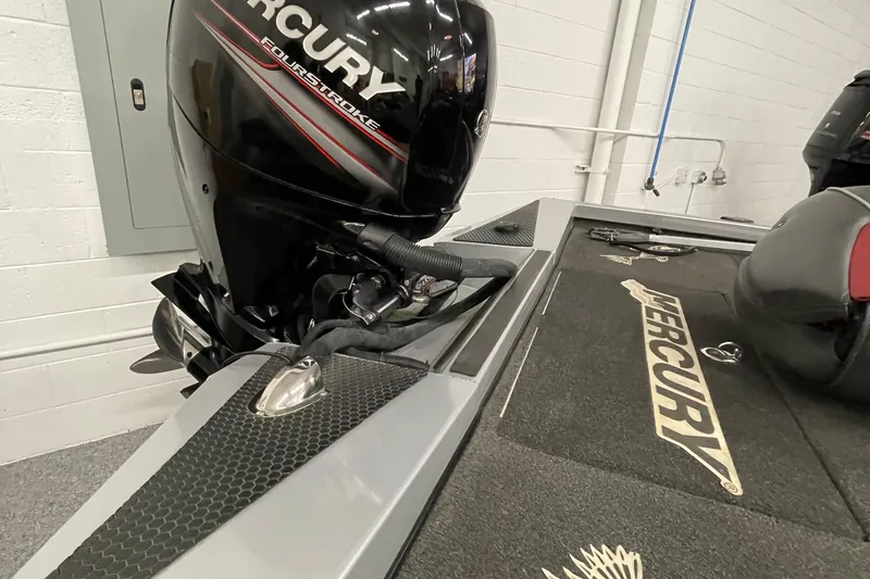 Slide: The Image of 2018 Ranger RT198P boat with Mercury FourStroke engine in a garage setting. - 5