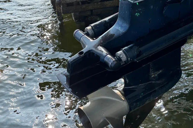 Slide: The Image of Close-up of a 1996 Bayliner 2659 Rendezvous boat motor in water. - 6