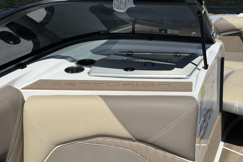 Slide: The Image of 2023 Centurion Fi25 boat interior with beige seating and cup holders. - 10